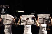 Three people with newspapers in front of face